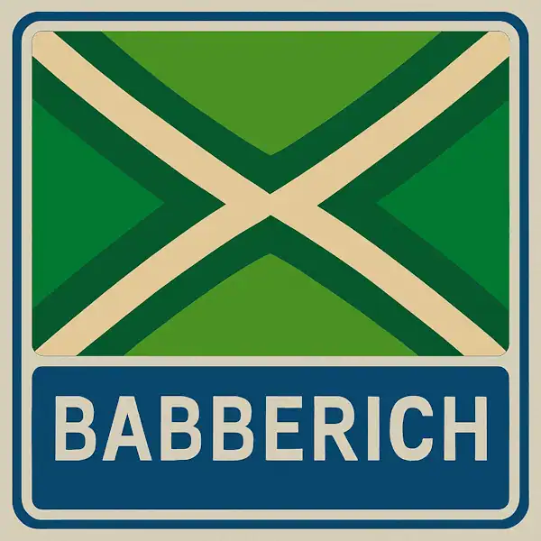 Plaatsnaambord met de tekst "BABBERICH" in witte hoofdletters op een blauw vlak, met daarboven een groene vlag met een crèmekleurig kruispatroon.