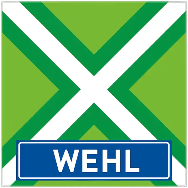 Plaatsnaambord met de tekst "WEHL" in witte hoofdletters op een blauwe balk. Daarboven een vlag met lichtgroene achtergrond, een helder wit St. Andrieskruis gecentreerd in een donkergroen kruispatroon — volledig volgens het originele vlagvoorbeeld, formaat 600x600.